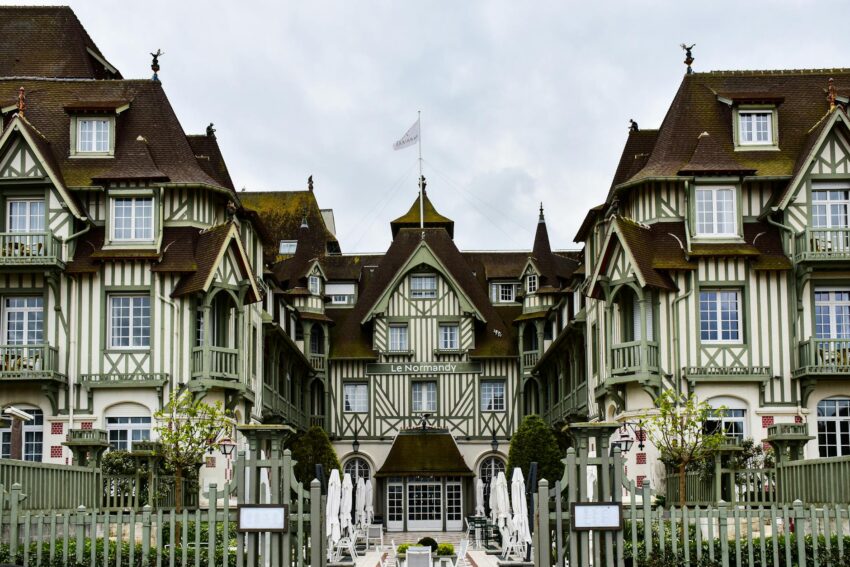 a large building with many windows and a gate